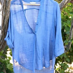 Sheer blue tunic with roll tab sleeves